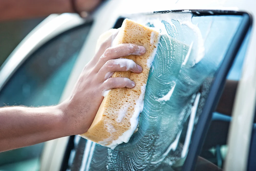 Car Cleaning With Soapy Sponge
